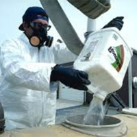 Pesticide mixing using PPE.